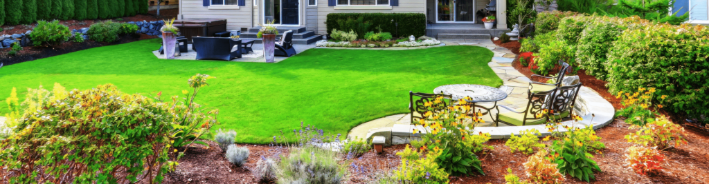 Backyard transformation with beautiful landscaping planter beds and sod installation