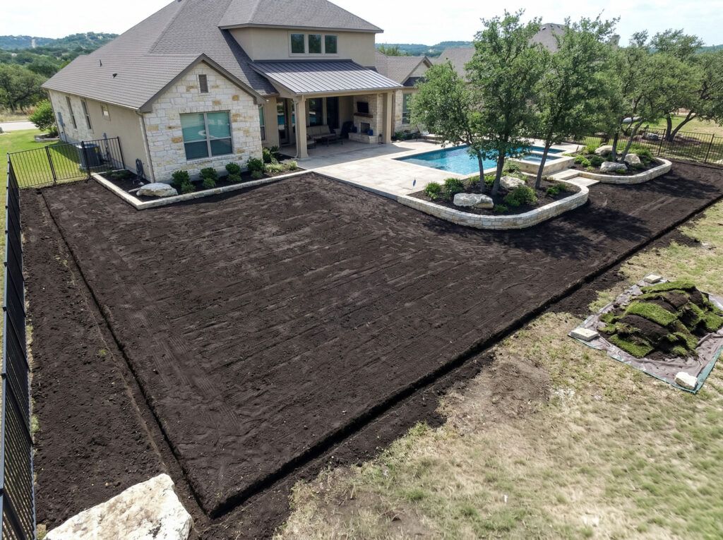 Excavated yard with straight edges, soil removed and base leveled for artificial turfgrass installation service