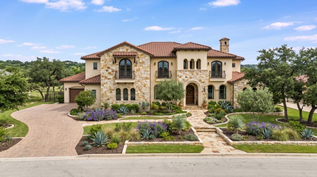 Mediterranean Tuscan front yard with structured planting beds, drought-tolerant shrubs, and stone accents