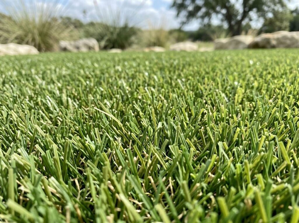 MultiUse Flex Turf artificial turf being installed in a San Antonio, TX backyard, seams aligned for a smooth surface.