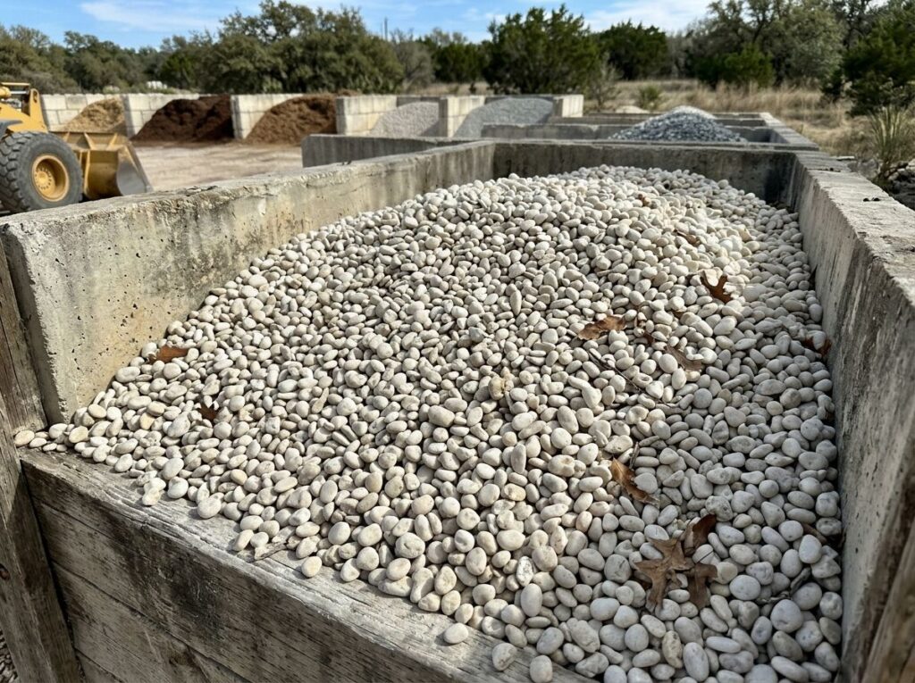 White Pea Gravel ground cover with small smooth white stones spread evenly for landscaping.